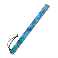 A rectangular blue and green mermaid scale patterned slapper with a black wrist strap, shown on a plain white background.