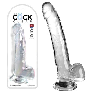 a clear long detailed penis shaped dildo with balls and a suction cup, shown next to its plastic packaging