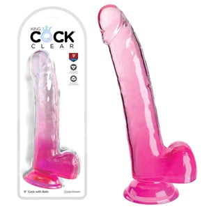 a long pink detailed penis shaped dildo with balls and a suction cup, shown next to its plastic packaging