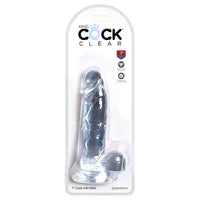 a clear detailed penis shaped dildo with balls and a suction cup, shown in its plastic packaging