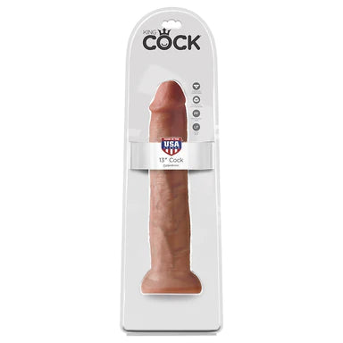 a tan penis shaped dildo with a suction cup base shown in its plastic packaging