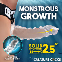 Advertisement for 'Creature Cocks' product showing arm with growth enhancement device and text 'Monstrous Growth'.