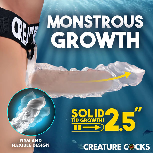 Advertisement for 'Creature Cocks' product showing arm with growth enhancement device and text 'Monstrous Growth'.
