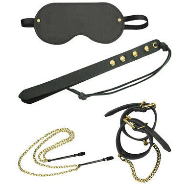a black blindfold, a double tipped paddle with gold studs, black wrist cuffs with a gold chain and nipple clamps with a double gold chain