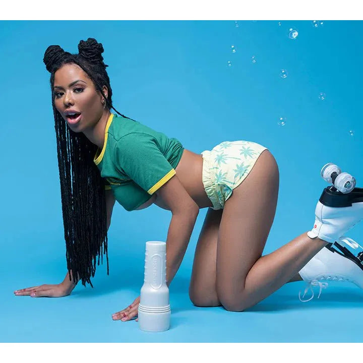 kira noir in green shirt and floral shorts posing with a fleshlight on a blue background with roller skates