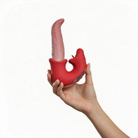 Tongue shaped vibrator with clitoral licker product held in a hand against a white background