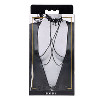 Black choker necklace on a mannequin bust with 'Sex & Mischief' branding on packaging.