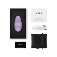 lilac hand held massager with box packaging and accessories with lelo branding