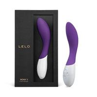 purple and white g-spot vibrator beside box packaging