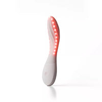 white vibrator with red lights on a white background