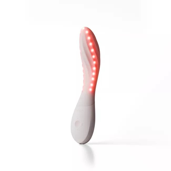 white vibrator with red lights on a white background