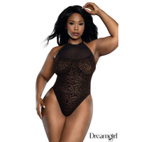 Model wearing a black leopard print bodysuit with 'Dreamgirl' branding.