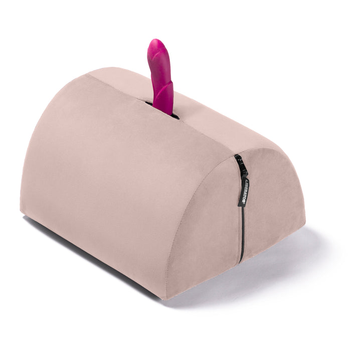 a pink rounded wedge with a pink vibrator poking out of top