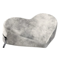 grey heart-shaped pillow on a white background