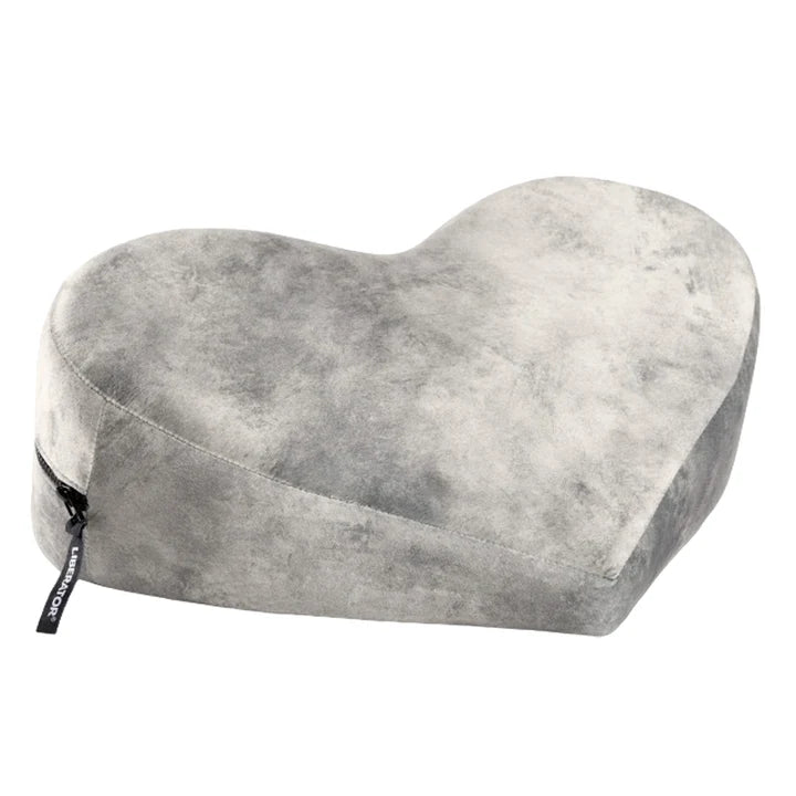 grey heart-shaped pillow on a white background
