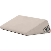 cream wedge pillow with a liberator logo on a white background