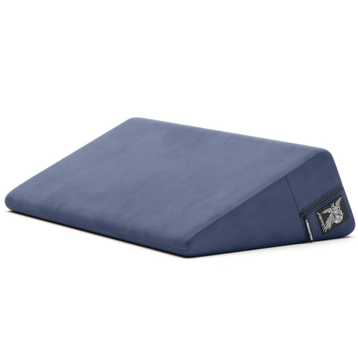 navy wedge pillow with a liberator logo on a white background