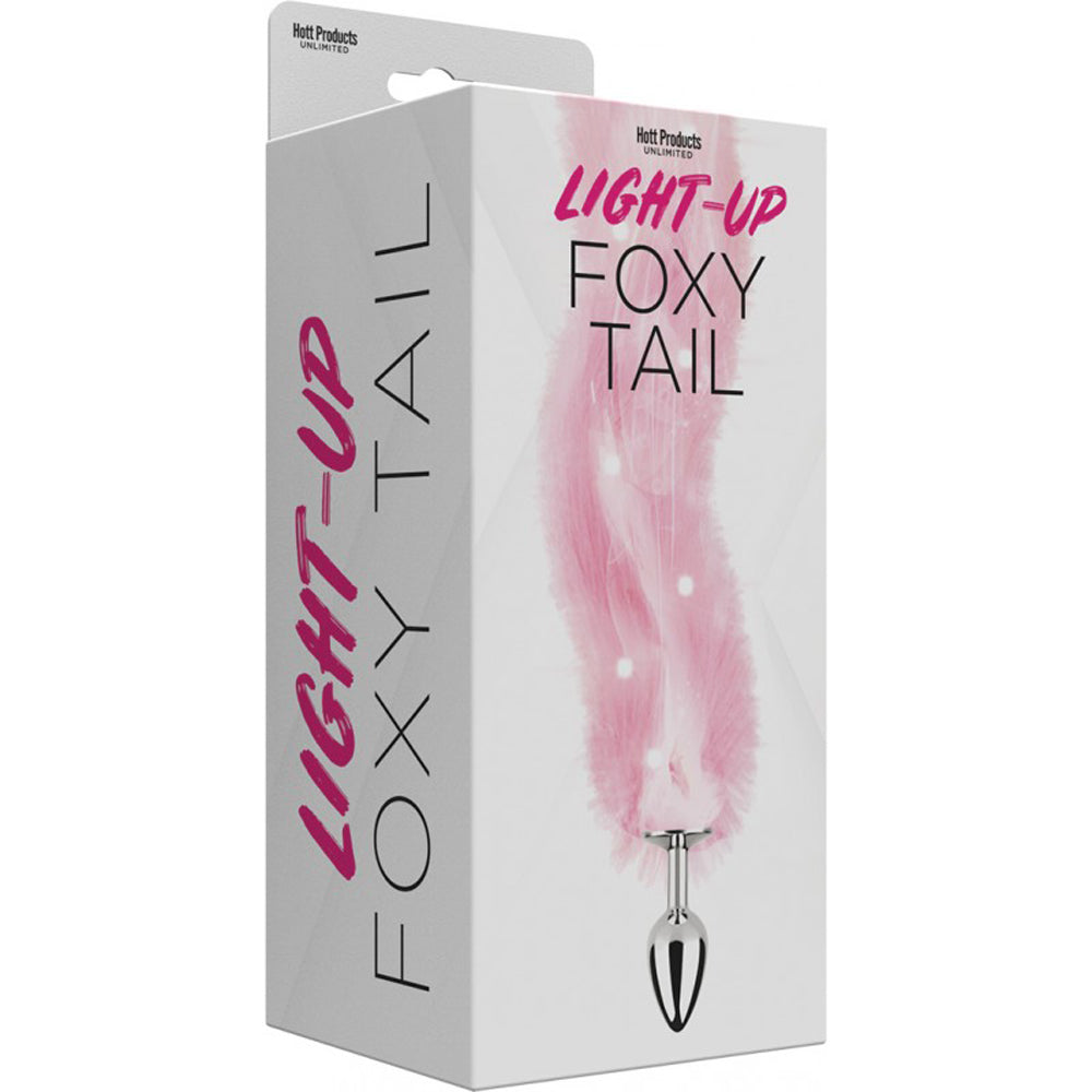 pink light up fox tail anal plug on box packaging
