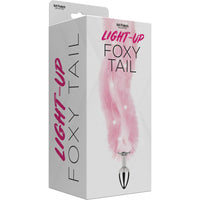 pink light up fox tail anal plug on box packaging