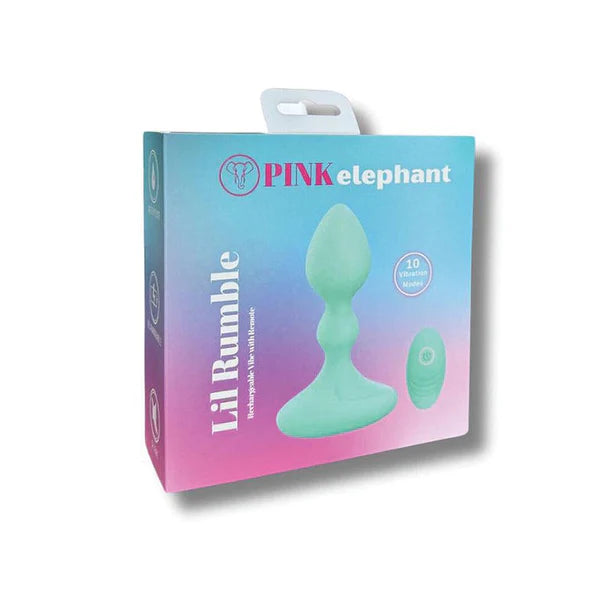 Pink elephant Lil Rumble adult novelty product in its retail packaging, featuring a pastel mint green silicone plug and remote on a blue-to-pink gradient box.