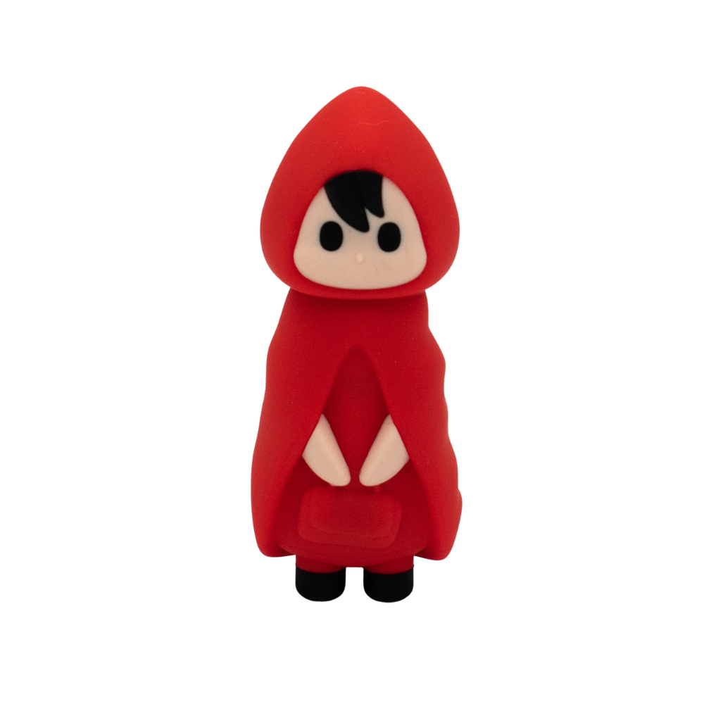 Toy figure of a character in a red hooded outfit on a white background