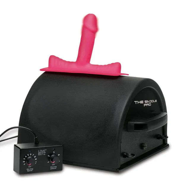 Black sex machine with pink component labeled 'The Saddle Pro' on a white background