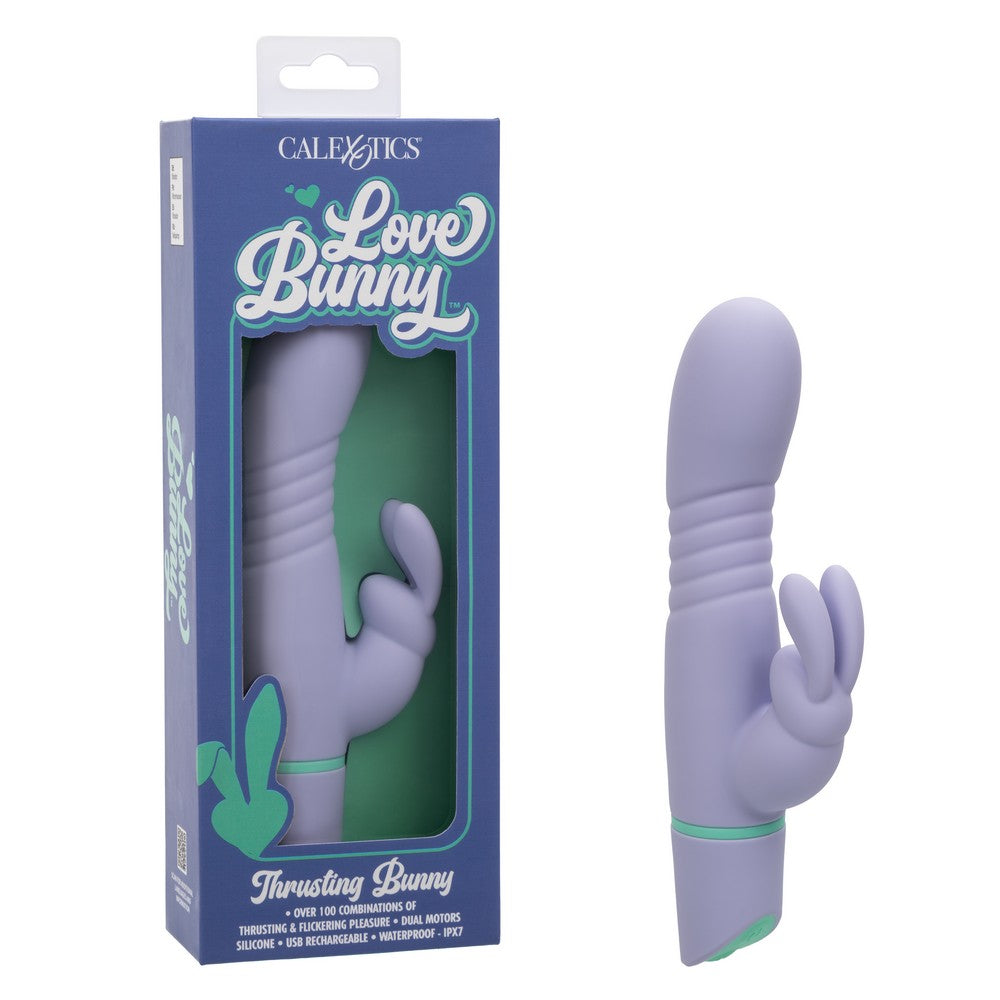 lilac colored vibrator with ridges in middle. bunny rabbit clitoral stimulator beside box