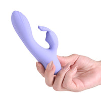 lilac vibrator with rabbit clitoral stimulator held in hand