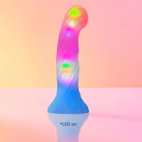 light up dildo on colored background