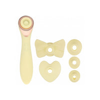 Set of yellow attachments for a handheld device on a white background