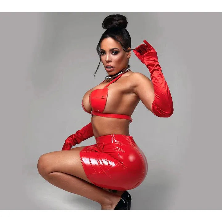 luna star wearing a red outfit with a glossy skirt on a gray background