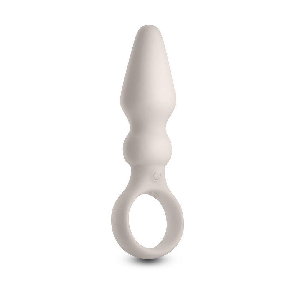 White silicone anal plug with finger ring on a white background