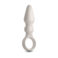 White silicone anal plug with finger ring on a white background