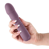 Hand holding a purple poise thrusting vibrator white background
