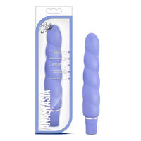 purple ribbed vibrator beside packaging