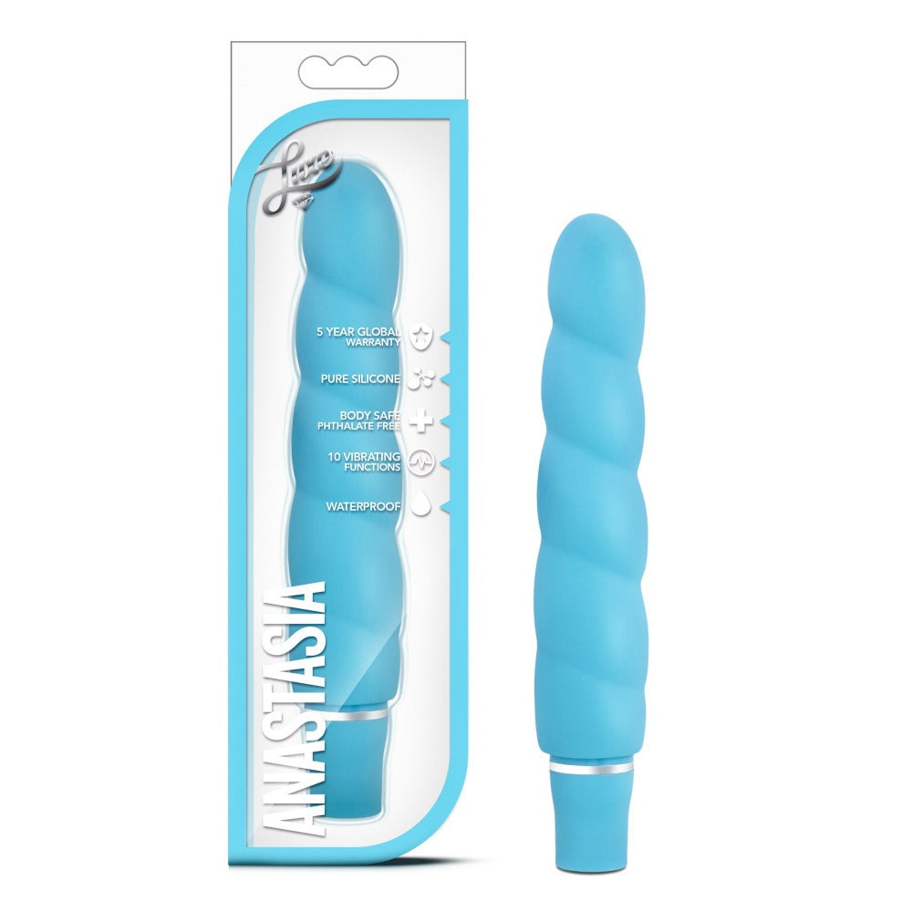 blue ribbed vibrator beside box