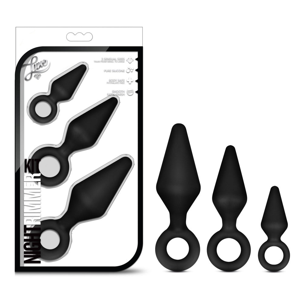 3 black anal plugs with finger ring holders beside box packaging