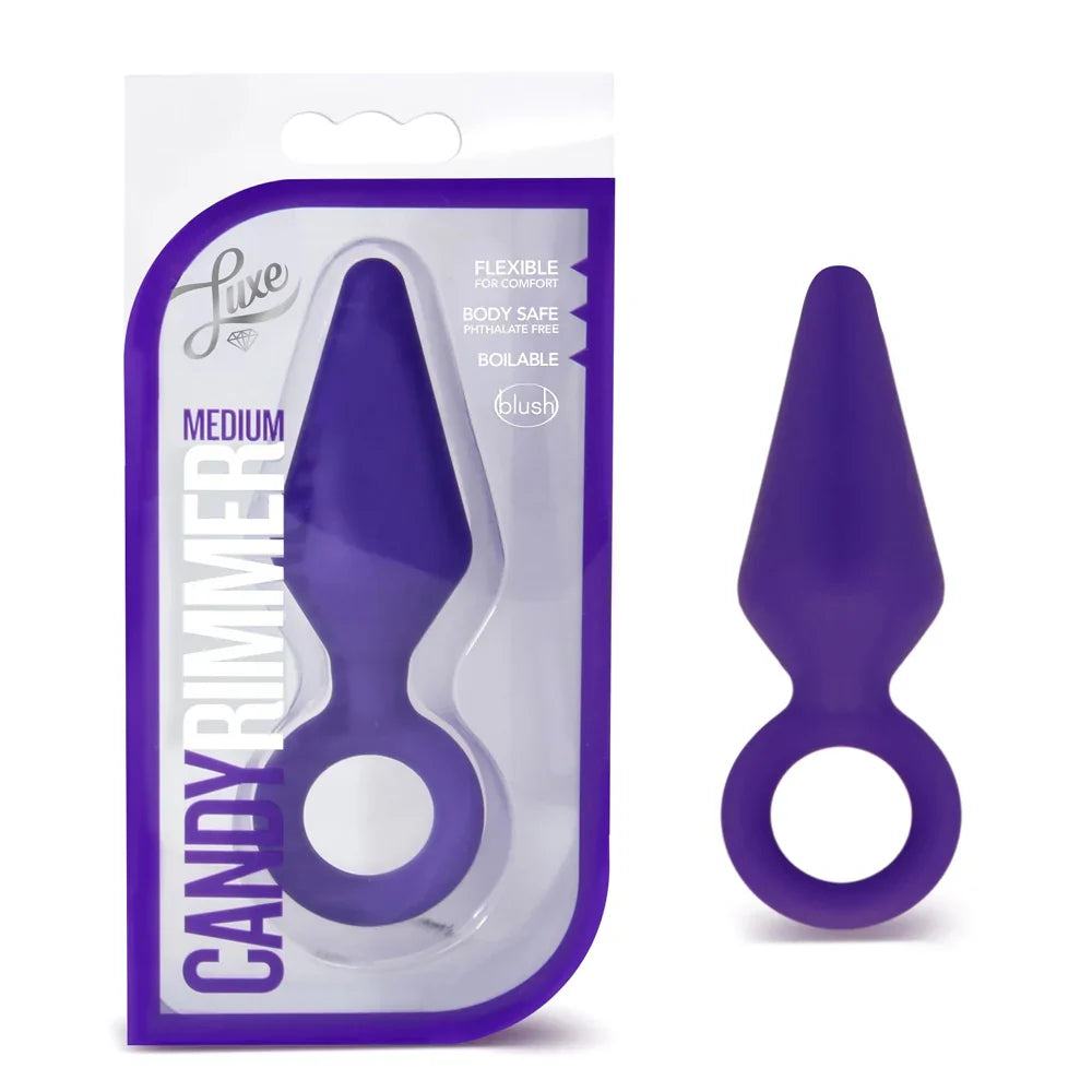 Purple flexible ring anal plug with packaging labeled 'Luxe Candy Rimmer' on a white background