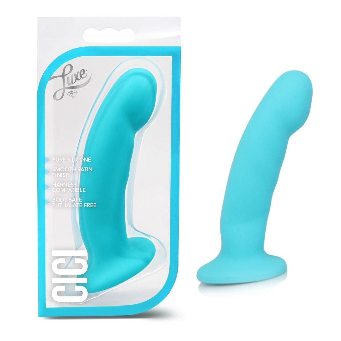 A bright turquoise silicone adult novelty product shown next to its retail packaging. The package is a clear blister card with a turquoise border and the brand name 'Luxe' visible at the top left.
