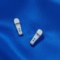 Magic wands white silver and blue earrings example photo.