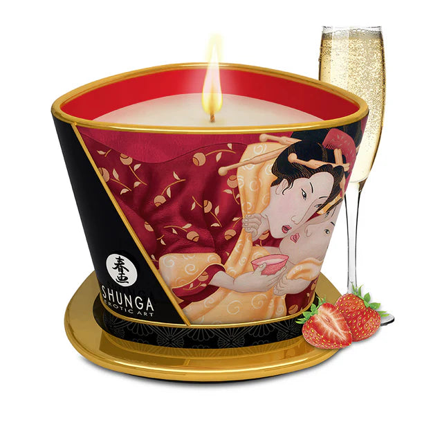 Shunga candle with geisha design, a glass of champagne, and strawberries on a white background