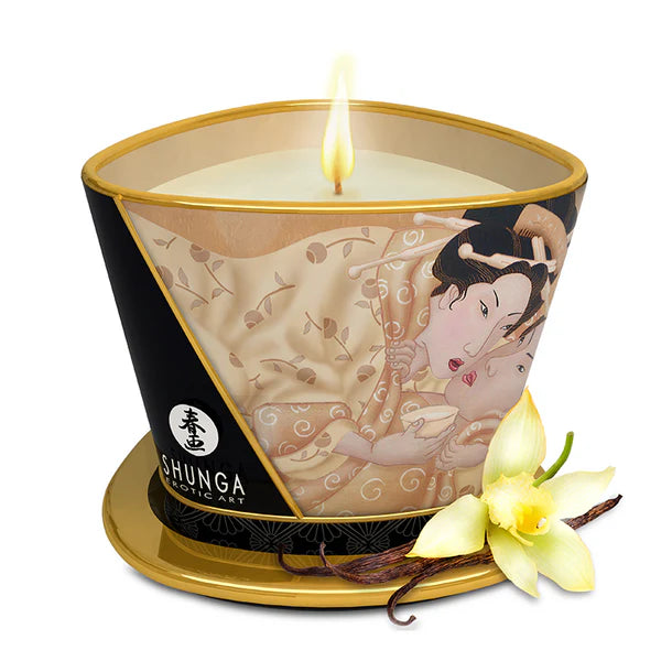 Shunga candle with artistic design and vanilla flower on a white background