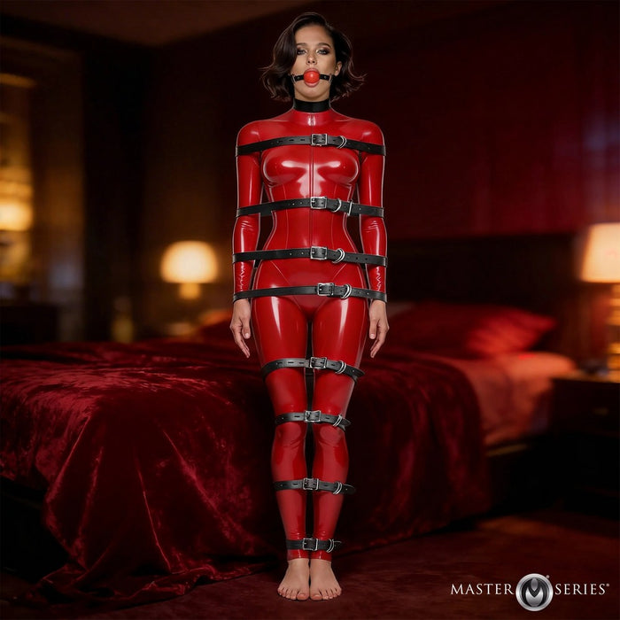 Person wearing a red latex outfit with black straps in a dimly lit room.