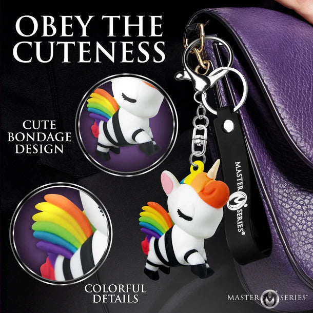 Keychain with cute design featuring a unicorn and rainbow colors, attached to a purple leather bag.