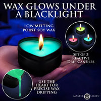 A heart-shaped black tin candle held in a hand, glowing with bright turquoise wax under a blacklight. The image includes marketing text, circular inset photos of three lit reactive drip candles, and a 'MASTER M SERIES' logo at the bottom right.