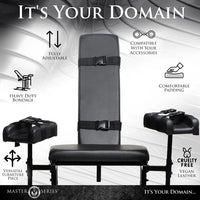 Black bondage chair with adjustable features on a gray background, featuring Master Series branding.