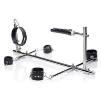 metal restraint system with dildo on white back ground