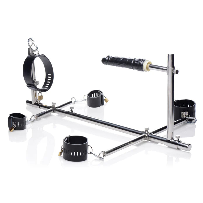 metal restraint system with dildo on white back ground