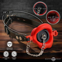 Black leather gag with red retractable leash on a wooden surface, showing measurements and product features.