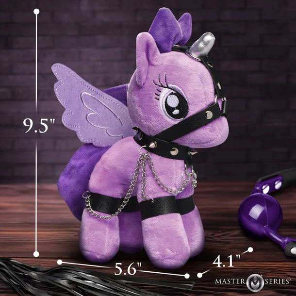Purple plush toy with chains and measurements on a wooden surface